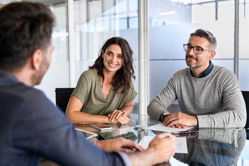 Couple meeting financial advisor for investment
